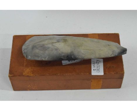 A neolithic polished flint axe head - found in mid-Norfolk - 19 cm long