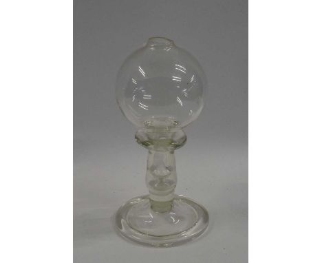 A lace makers lamp, probably 19th Century of typical shape, the bulbous bowl above a collar, stem and folded foot, 20cm high