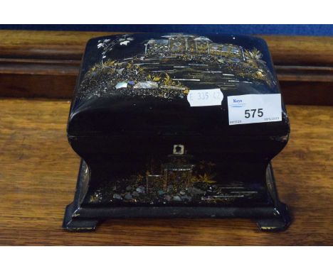 A Victorian black lacquer and mother of pearl inlaid tea caddy of wasted form, 20cm wide