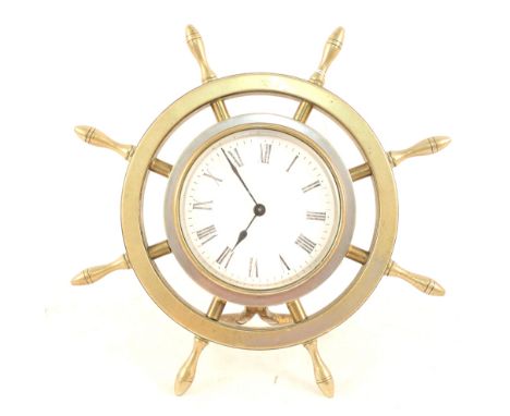 A brass ships wheel easel clock