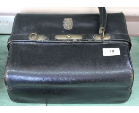 A leather doctors bag containing a large Victorian papier mache snuff box, collectors tins etc