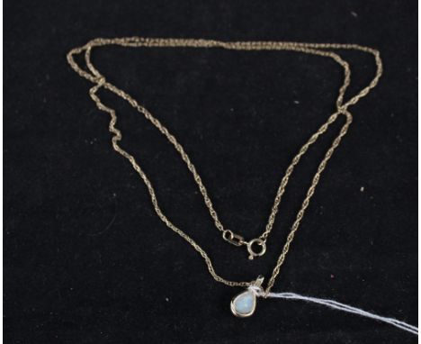 A 9ct gold opal pendant on 9ct gold chain