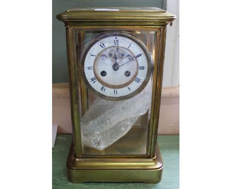 A brass four glass clock