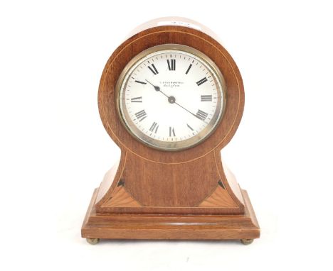An Edwardian mahogany balloon clock dial marked Lister Horsfall, Halifax