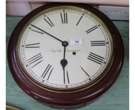 A circular mahogany Seth Thomas wall clock