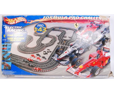 A Hot Wheels 1/43 scale Formula Pro Challenge racing set. Re-sealed within the original box. Contents unchecked.&nbsp;