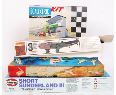 Four vintage &amp; contemporary various branded model kits to include; Scalextric Owners Stand &amp; Racing Pit, Matchbox 1:7