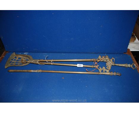 Three brass fire tools.