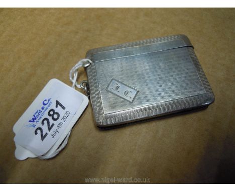 A Birmingham 1925 hallmarked silver Vesta case with engine turned decoration and initials T.C engraved marks John Rose, 44.9 