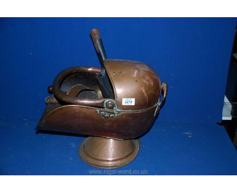 A Copper helmet Coal Scuttle and two copper scoops