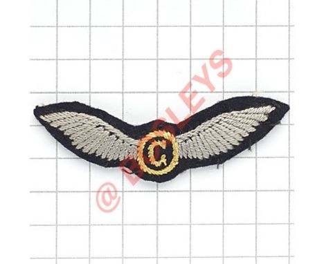 WW2 period 2nd Glider Pilot cloth embroidered wing. A good padded example; yellow G within a circle flanked by pale blue wing
