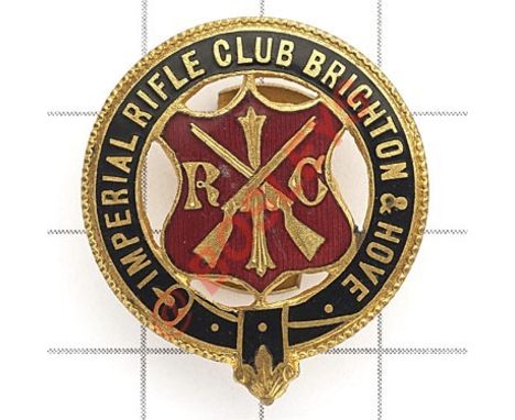 Imperial Rifle Club Brighton & Hove lapel badge. Blue enamel title strap; central red shield with crossed rifles and IRC  But