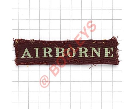 AIRBORNE WW2 straight shoulder cloth title / strip. Light blue printed on maroon.  Removed from uniform GC 