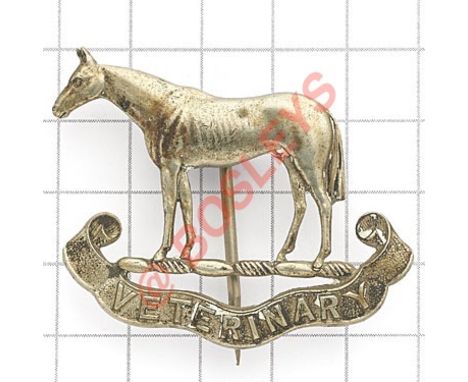 Indian Army Veterinary Service pagri badge. British made die-cast white metal. Horse over “Veterinary” scroll.  Stout pagri p