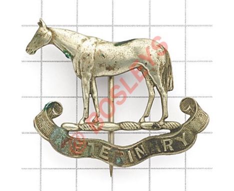 Indian Army Veterinary Service pagri badge. Another British made die-cast white metal. Horse over “Veterinary” scroll.  Stout