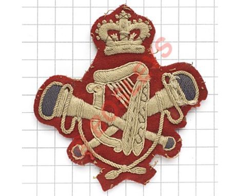 British Army Victorian bandsman’s scarce arm badge. Heavily white embroidered crowned crossed trumpets with blue bell ends, h