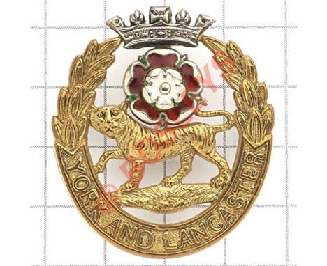 York and Lancaster Regiment Officer’s cap badge. Die-cast gilt with applied silvered coronet and red and white enamel rose.  