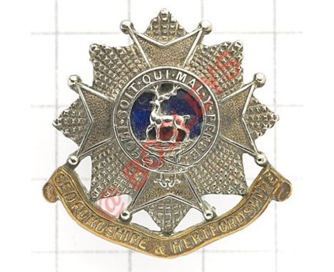 Bedfordshire & Hertfordshire Regiment Officer’s silvered, gilt & blue enamel cap badge. Small die-cast pre 1958  Loops Gilt w