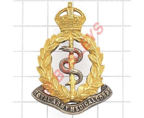 Royal Army Medical Corps Edwardian Officer’s cap badge circa 1901-10. Fine die-cast example. Gilt crowned wreath, the rod of 