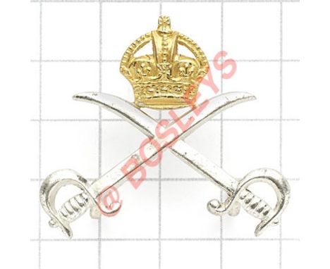 Army Physical Training Corps scarce pre 1953 Officer’s cap badge. Die-cast silvered crossed sabres surmounted by gilt crown. 