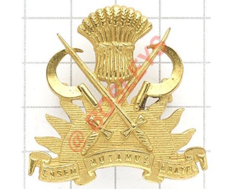 Indian Army. Military Farms Department Officer’s cap badge. A fine scarce British made die-cast rich gilt example. (Cox 2598)