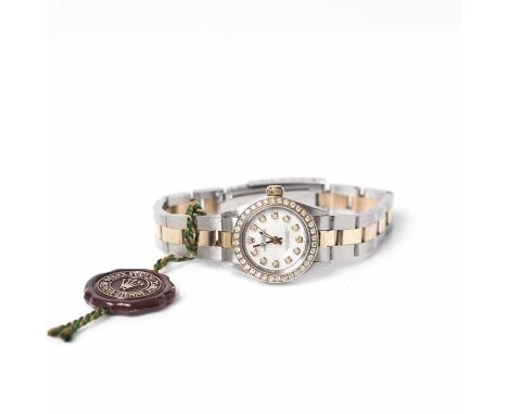 LADY'S BI-COLOUR STAINLESS STEEL DIAMOND SET ROLEX DATEJUST WRISTWATCH
1977, model number 6719, signed automatic movement, th