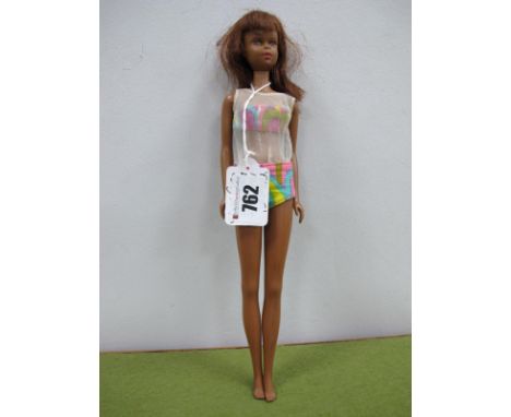 A Black Francie Doll, slight loss of paint on eyebrow, outfit playworn, marked 1966 Mattel Made in Japan 507 on her head