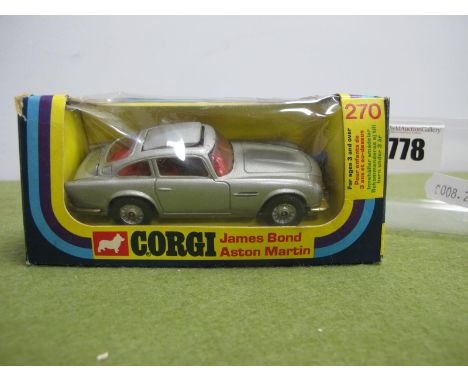 A Corgi Toys No 270 Diecast Model James Bond Aston Martin, two Bandit figures present, slight crushing and small tears to pic