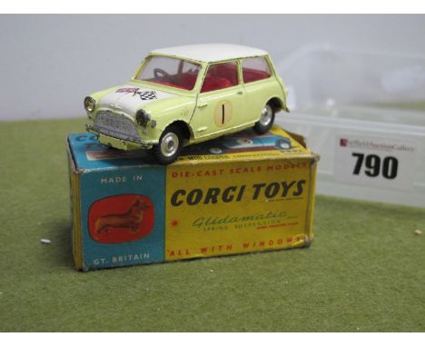 A Boxed Corgi Toys Diecast Model No. 227 Morris Mini Cooper, primrose yellow body, red interior, white roof RN1, multiple chi