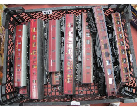 Fourteen Hornby Tri-ang Lima "OO" Gauge L.M.S Maroon Liveried Coaches and Rolling Stock, unboxed.