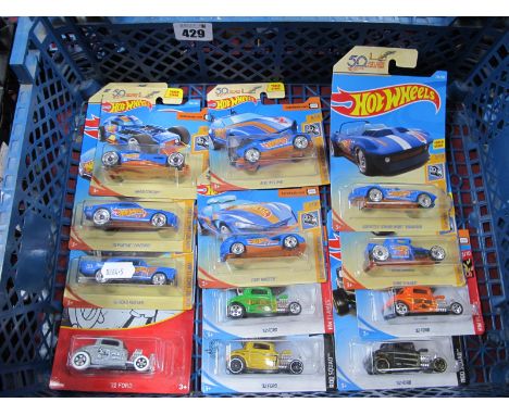 Twelve Hotwheels Diecast Model Cars, all carded to include 32 Ford Steamboat Willie, HW50 Race Team '70 Road Runner.