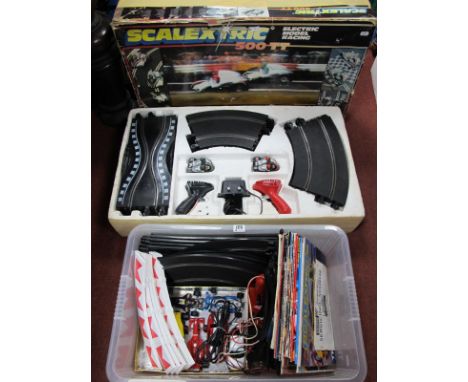 A Scalextric 500TT Slot Racing Set, box tatty; together with a quantity of playworn slot cars, track, Scalextric literature.