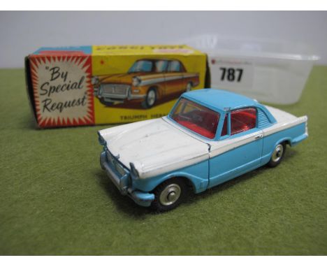 A Boxed Corgi Toys No. 231 Diecast Model Triumph Herald Coupe, mid blue top/bottom, white centre, chipping and scratches to p