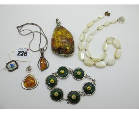 A Modern Amber Set Pendant, stamped "925"; together with two further pendants, an enamel panel bracelet and an ANA Norwegian 