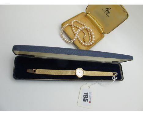 Eterna; A 9ct Gold Cased Ladies Wristwatch, the signed dial with line markers, the case back engraved "Presented by Walter La