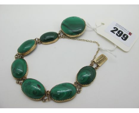 A Vintage Malachite Polished Panel Bracelet, oval and circular collet set, with concealed clasp. 