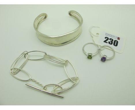 A Modern Hallmarked Silver Cuff Bangle, together with a modern oval link bracelet with T-bar fastener and two single stone dr