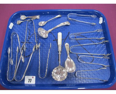 A Collection of Assorted Hallmarked Silver and Plated Sugar Tongs, together with a mother of pearl handled sifter spoon, a ca