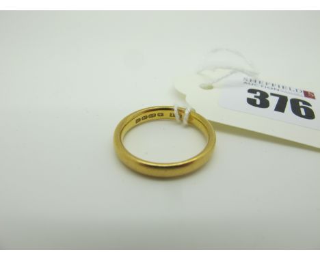 A 22ct Gold Plain Wedding Band, (finger size M) (4.3grams). 
