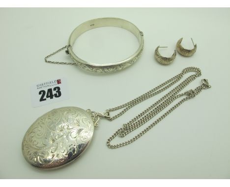 A Large Hallmarked Silver Oval Locket Pendant, of foliate design, on flat curb link chain, a hallmarked silver bangle with pa