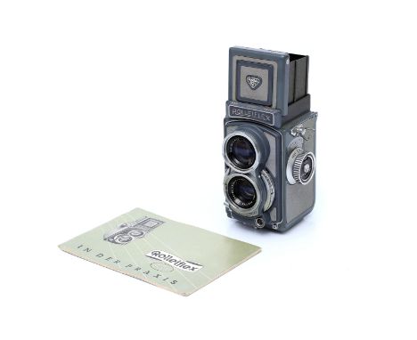 A Rolleiflex Baby 4x4 Grey TLR Camera, with Schneider Xenar f/3.5 60mm lens, complete with instruction manual