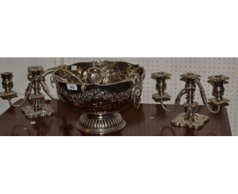 A silver plated punch bowl and ladle; a pair of silver plated candelabrum