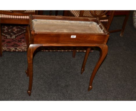 An early 20th century mahogany planter, cabriole legs 