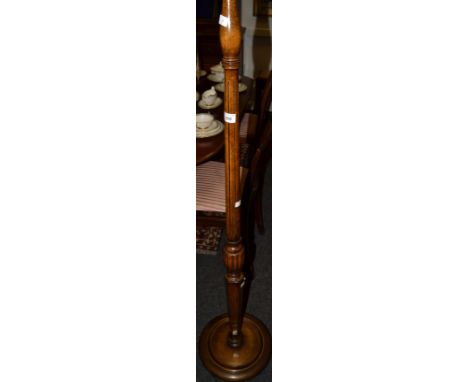 A 1930's walnut standard lamp