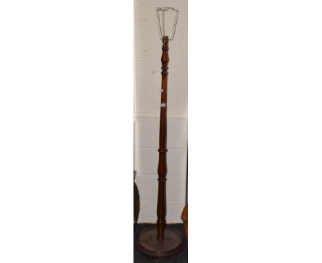 A mid 20th century mahogany standard lamp
