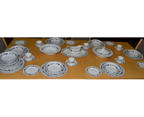 A Royal Doulton Burgundy dinner service, for ten;  six similar coffee cups and saucers
