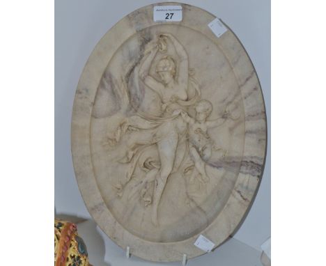 An oval marble plaque depicting a scantily clad maiden dancing with cherub holding a tambourine,  bronze roundel to verso ins