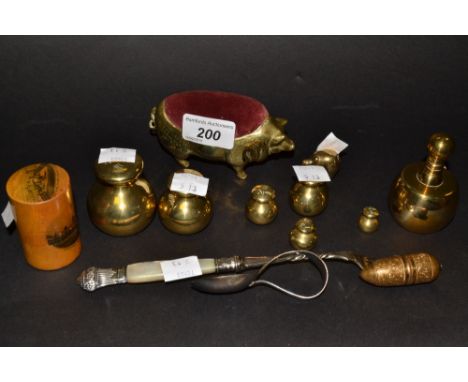 Bijouterie - a brass pig pin cushion, a Mauchline Ware box, set of brass weights, a baby's feeding spoon, a mother of pearl h