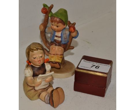 A Goebel figure Apple tree boy;  another singing girl;  a Caverswall Royal commemorative thimble, signed Grant, boxed (3)