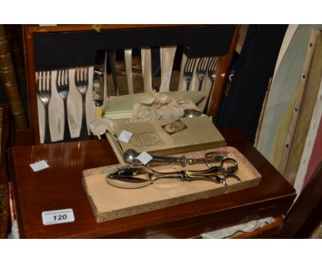Flatware - a mahogany cased set of flatware, sugar nips, bread fork, servers; etc